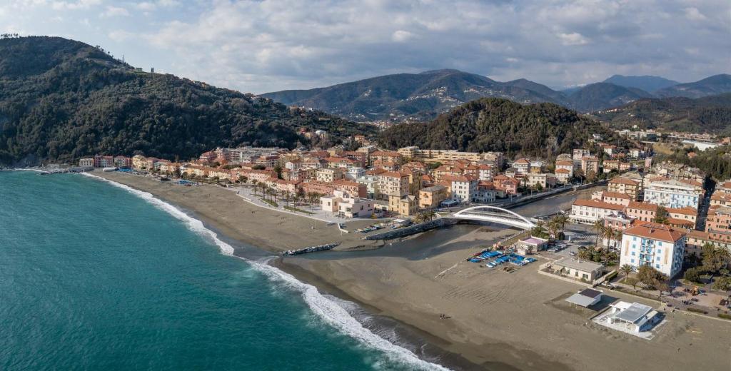 an aerial view of a beach with buildings and the ocean at La casetta della nonna in Sestri Levante