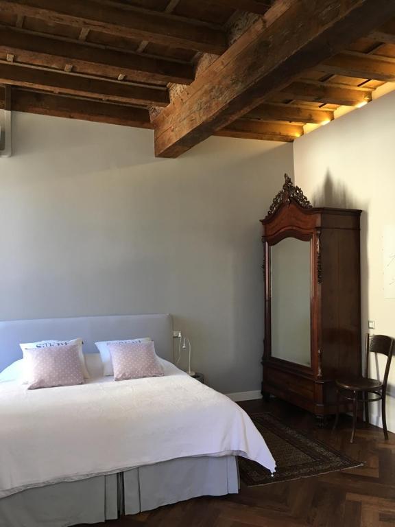 Postel nebo postele na pokoji v ubytování B&B L'Affresco
