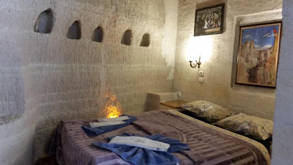 Postel nebo postele na pokoji v ubytování Anatolia cave hotel Pension