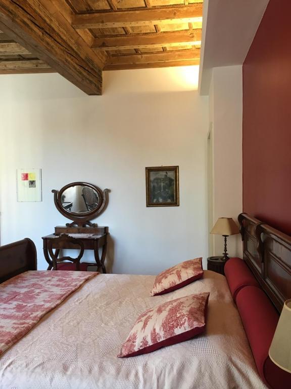 Postel nebo postele na pokoji v ubytování B&B L'Affresco