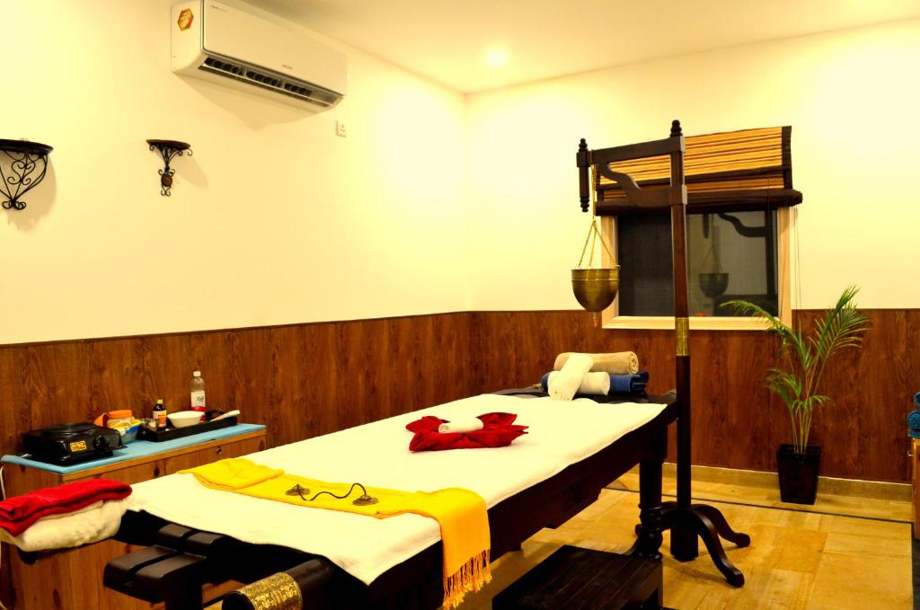 Postel nebo postele na pokoji v ubytování Veda5 Ayurveda & Yoga Retreat