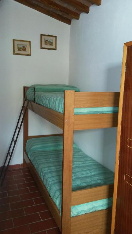 Łóżko lub łóżka w pokoju w obiekcie Camere Montalbano