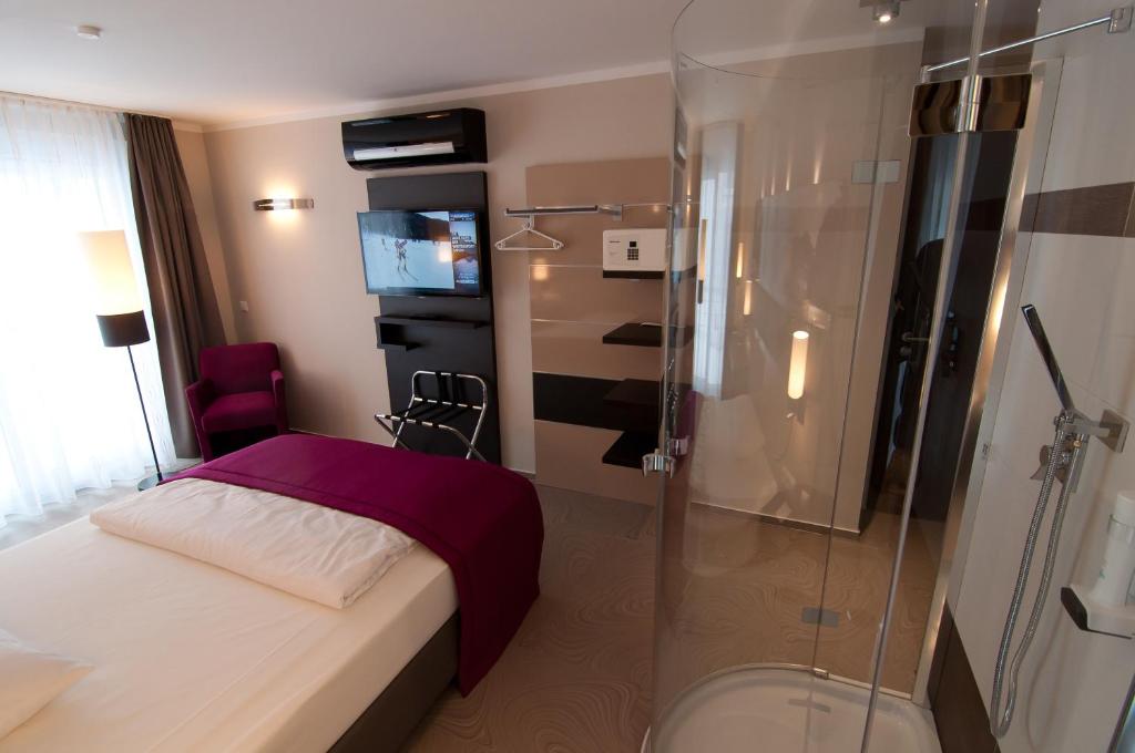 Postel nebo postele na pokoji v ubytování Amalienburg - Boutique & Boarding Hotel