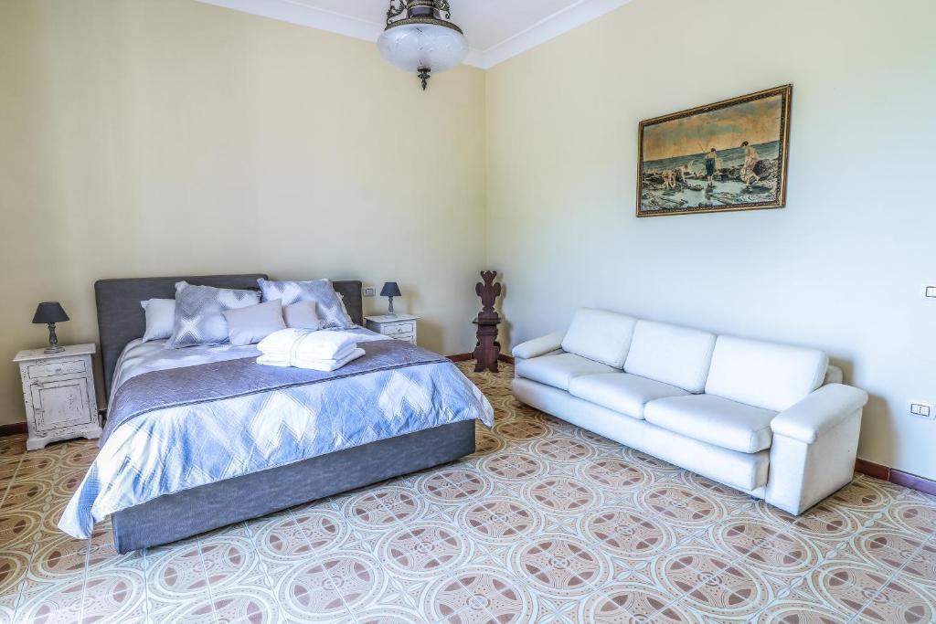 Postel nebo postele na pokoji v ubytování Scognamiglio Suites