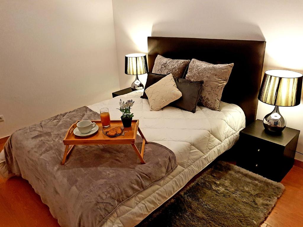 Кровать или кровати в номере Oporto Cozy Studio