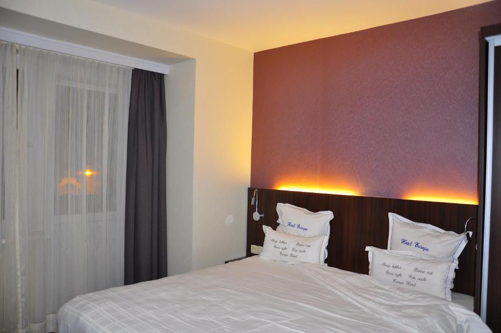 Postel nebo postele na pokoji v ubytování Hotel Europe