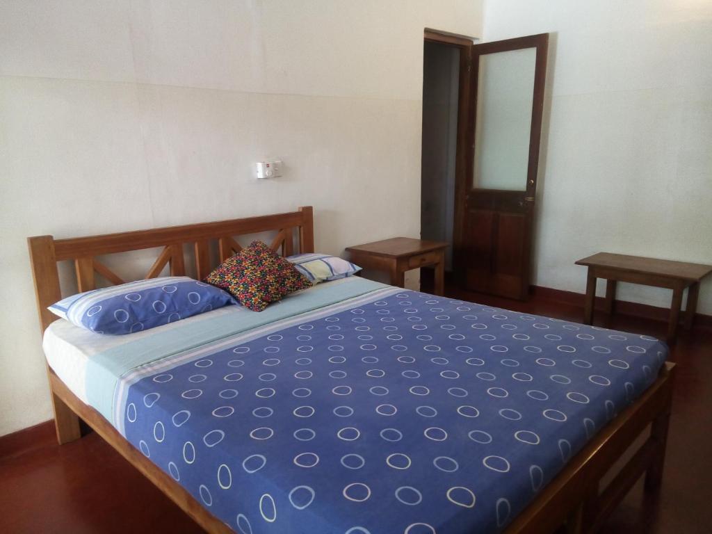 Postel nebo postele na pokoji v ubytování Hotel Mango Garden
