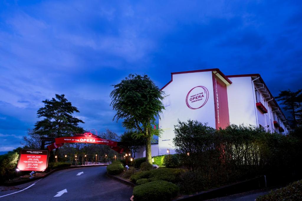 a building on the side of a road at night at Hotel Christmas Night at the Opera (Love Hotel) in Nishihara