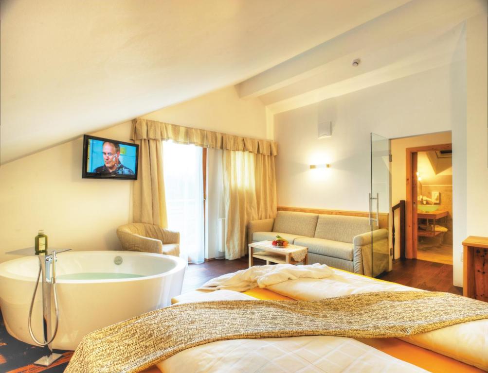 Postel nebo postele na pokoji v ubytování Hotel Leitner
