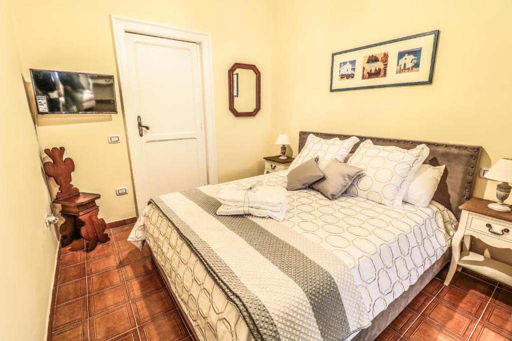 Postel nebo postele na pokoji v ubytování Scognamiglio Suites