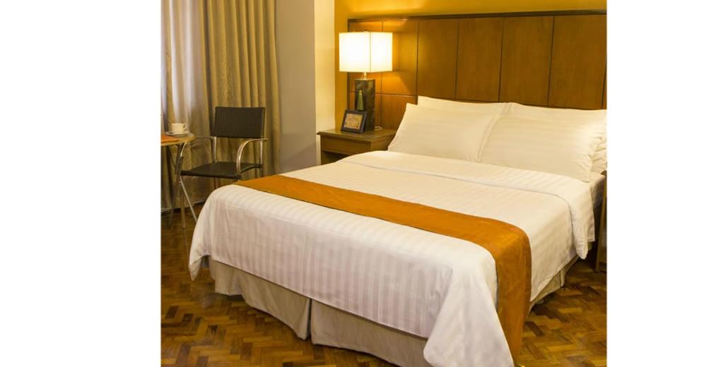 Postel nebo postele na pokoji v ubytování Comfy Inn Manila-Kalaw
