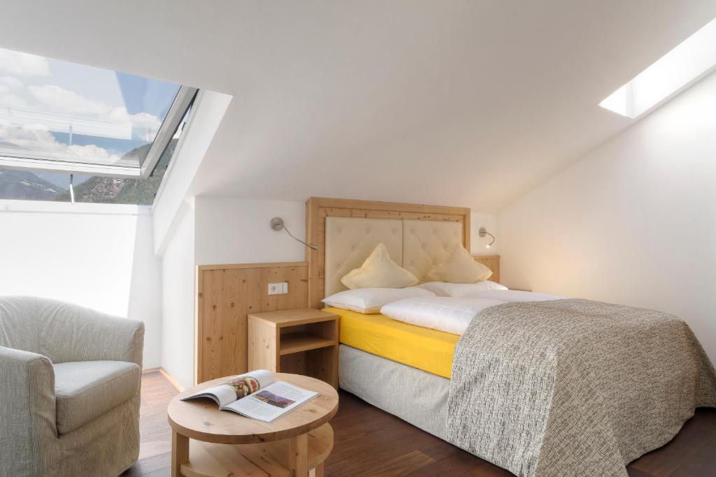 Postel nebo postele na pokoji v ubytování Hotel Leitner