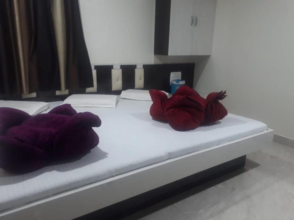 En eller flere senger på et rom på Hotel Arzoo Palace