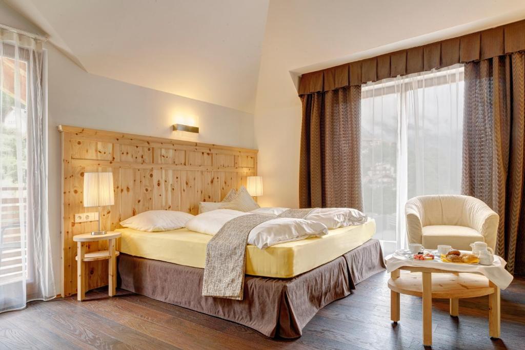 Postel nebo postele na pokoji v ubytování Hotel Leitner