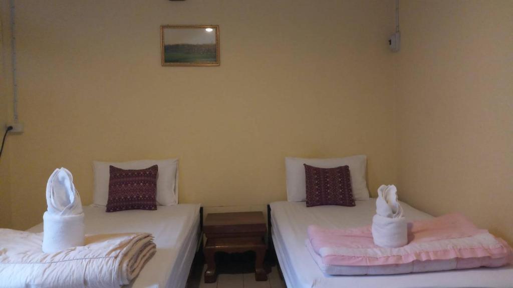 Postel nebo postele na pokoji v ubytování P.L.P Guesthouse - Mae Hong Son
