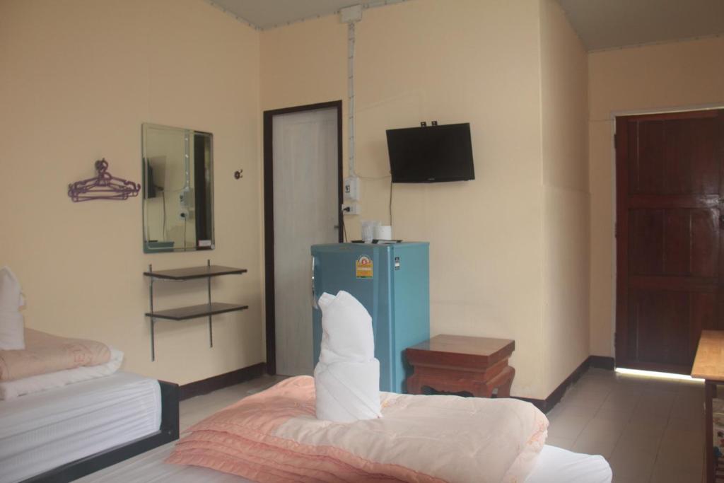 Postel nebo postele na pokoji v ubytování P.L.P Guesthouse - Mae Hong Son