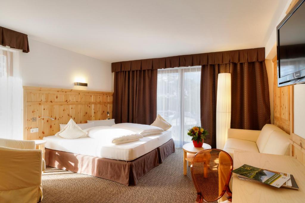 Postel nebo postele na pokoji v ubytování Hotel Leitner