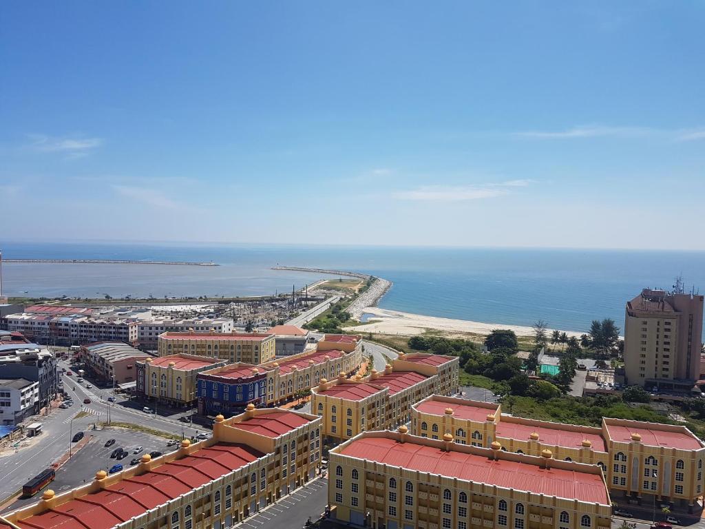 an aerial view of a city with the ocean at homestay seaview ainee - Muslim sahaja in Kuala Terengganu