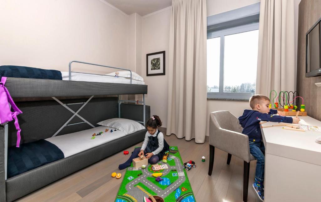 Postel nebo postele na pokoji v ubytování Living Hotel Milano