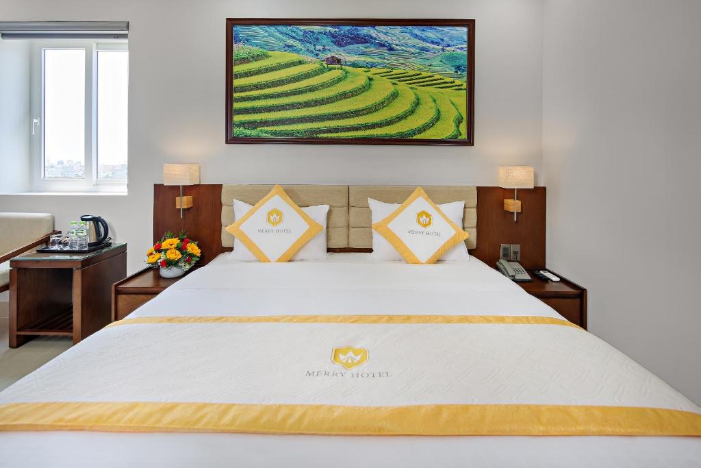 Postel nebo postele na pokoji v ubytování Merry Hotel