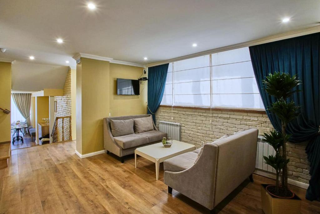 TV a/nebo společenská místnost v ubytování Jasmine Hotel