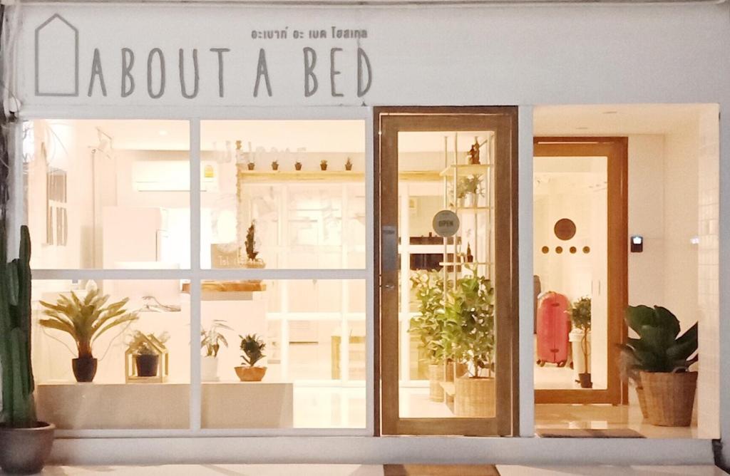 a store window with a sign about a bed at About A Bed Hostel Chiangmai in Chiang Mai