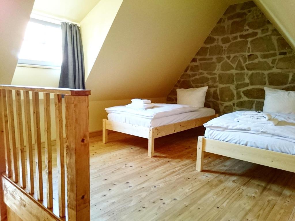 Postel nebo postele na pokoji v ubytování Hotel garni Tilia