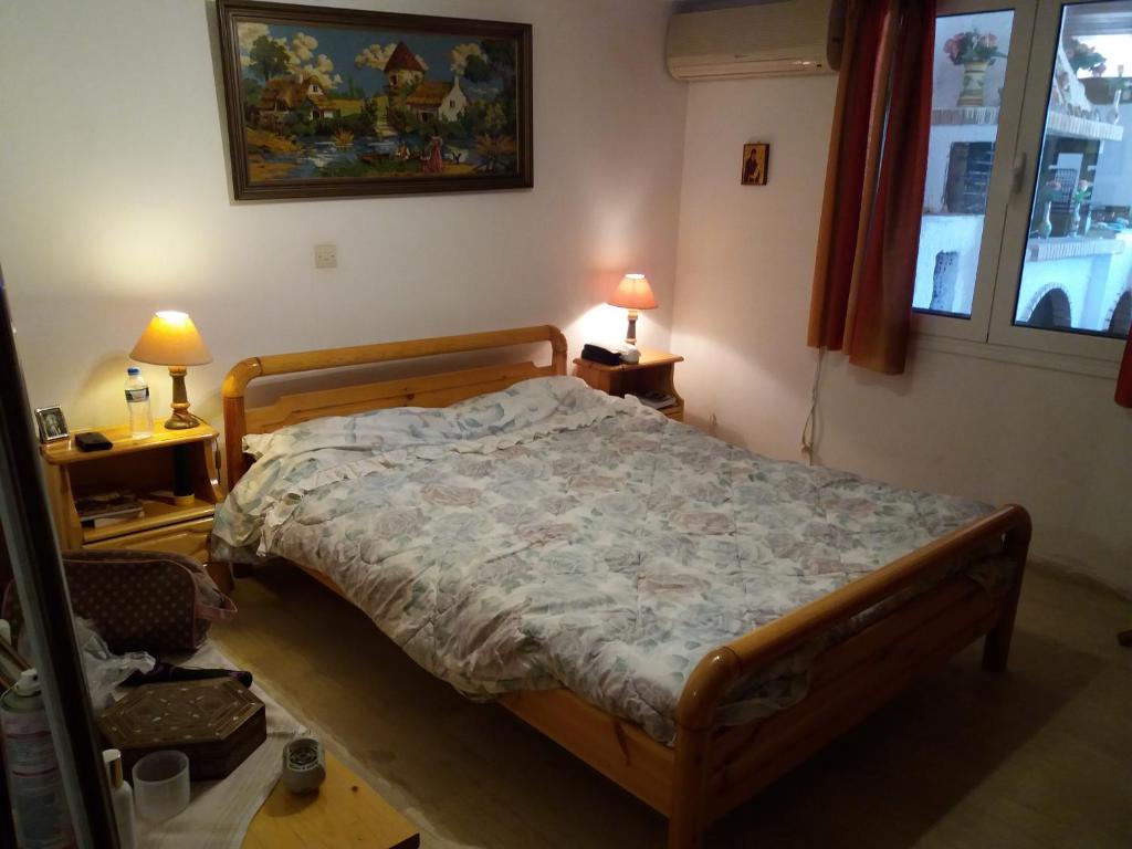 Postel nebo postele na pokoji v ubytování Aliki House