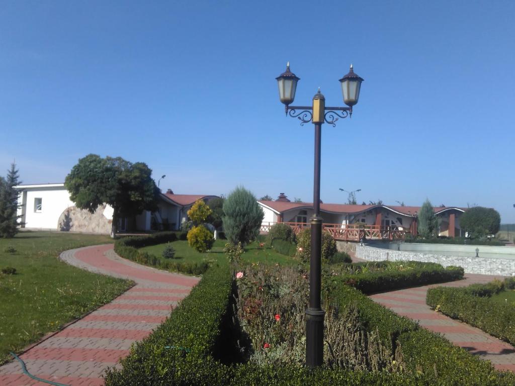 a street light in a park with a pathway at ГРК Золота Підкова in Chupyra