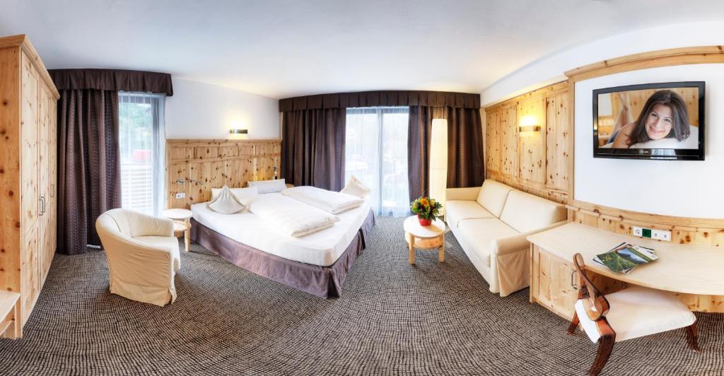 Postel nebo postele na pokoji v ubytování Hotel Leitner