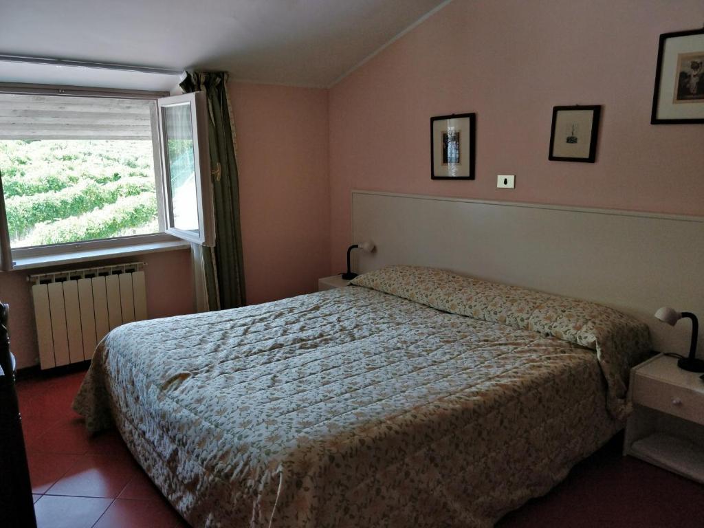 Postel nebo postele na pokoji v ubytování Hotel Barolo Classico