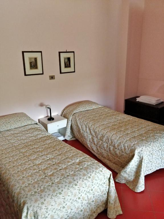 Postel nebo postele na pokoji v ubytování Hotel Barolo Classico