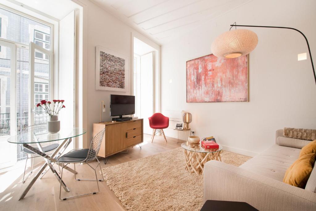 a living room with a couch and a table at Lisbon Rouge Apartment in the Lisbon Heart in Lisbon