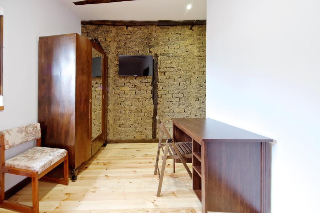 TV a/nebo společenská místnost v ubytování Albergue El Encanto