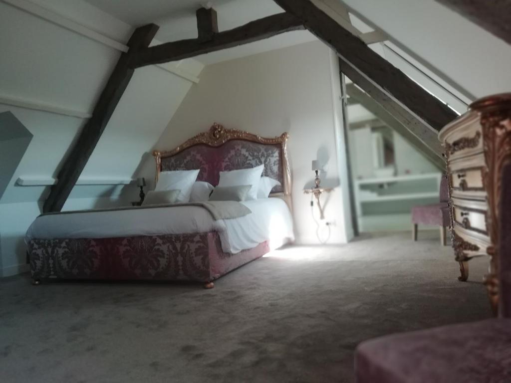 Postel nebo postele na pokoji v ubytování Domaine de Bayeux