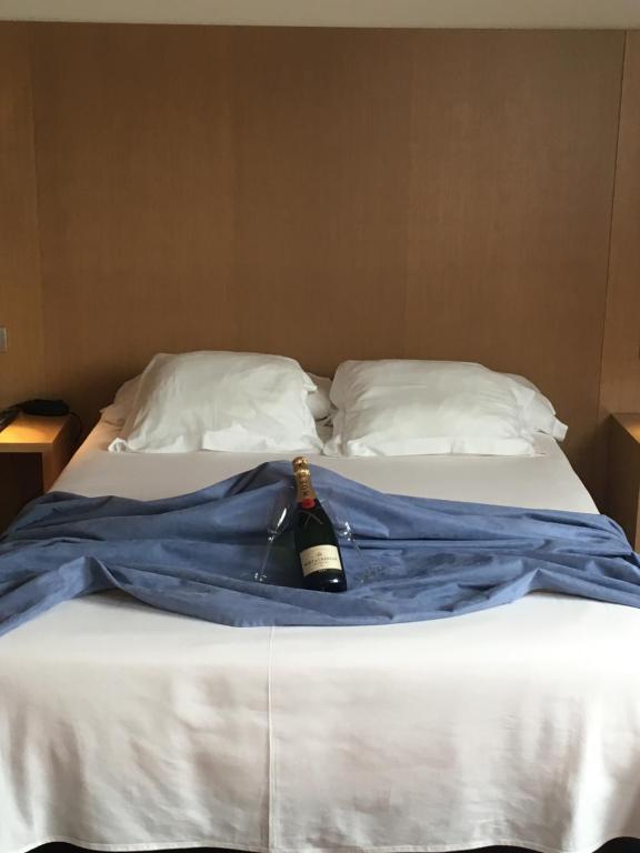 A bed or beds in a room at Hotel Ril