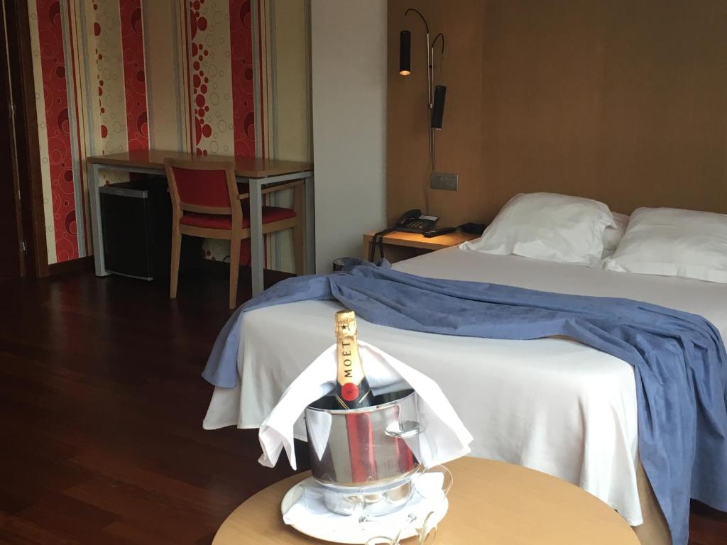A bed or beds in a room at Hotel Ril