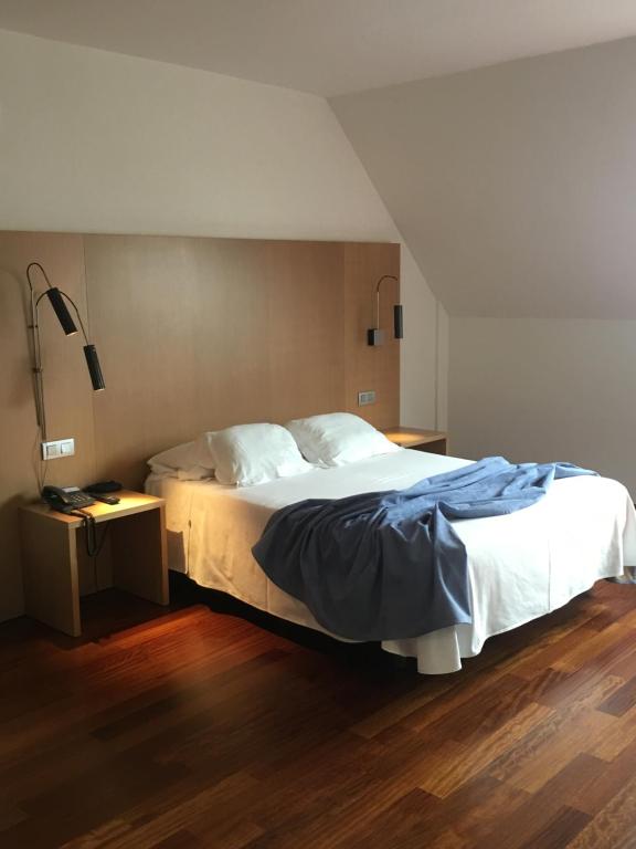 A bed or beds in a room at Hotel Ril