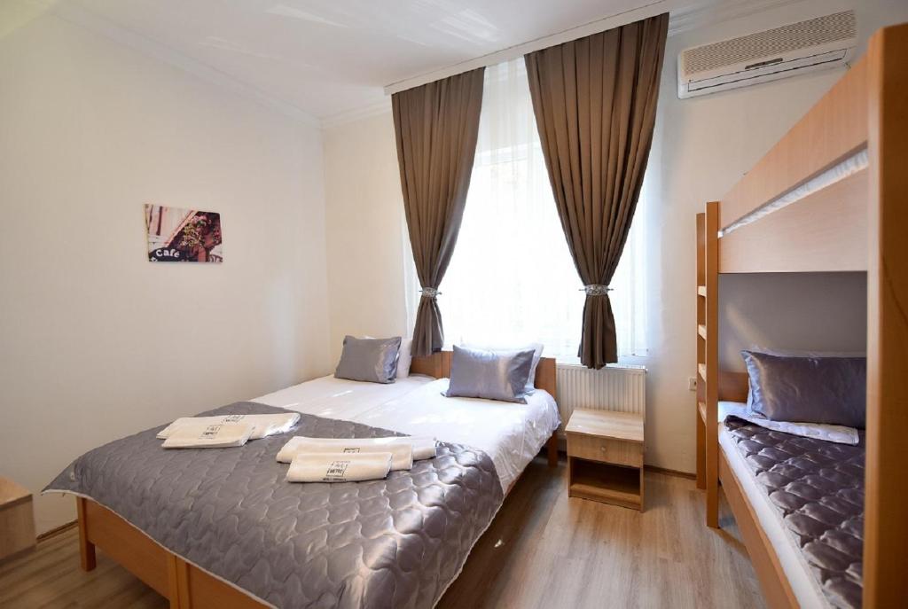 Postel nebo postele na pokoji v ubytování Villa Nina Hotel & Lounge bar
