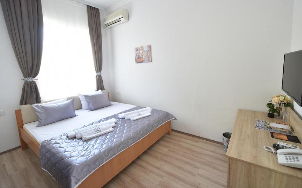 Postel nebo postele na pokoji v ubytování Villa Nina Hotel & Lounge bar