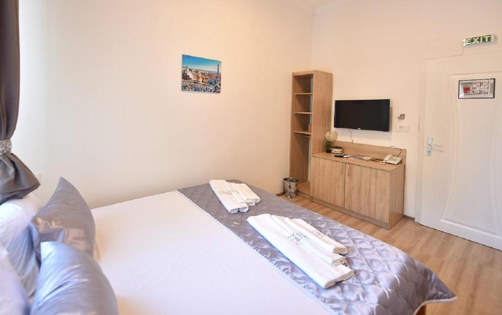 Postel nebo postele na pokoji v ubytování Villa Nina Hotel & Lounge bar