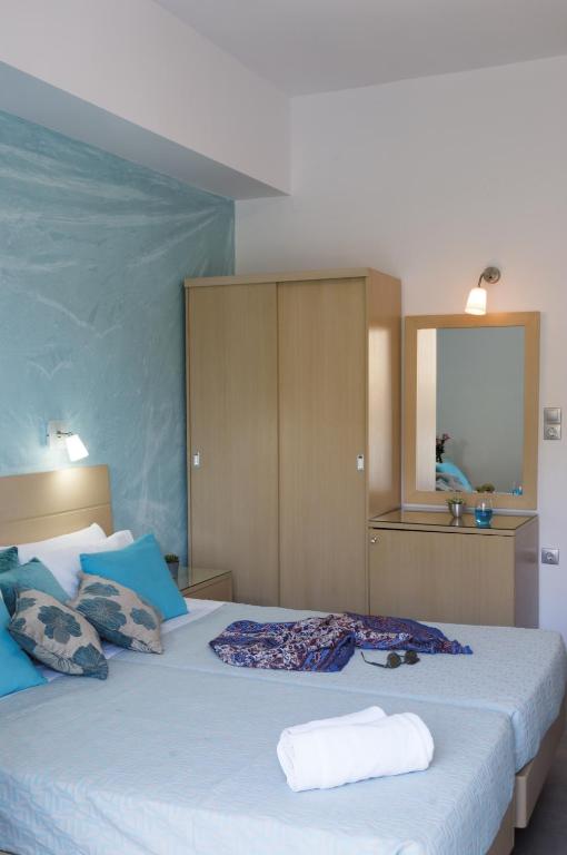 Кровать или кровати в номере Blue Harmony Hotel