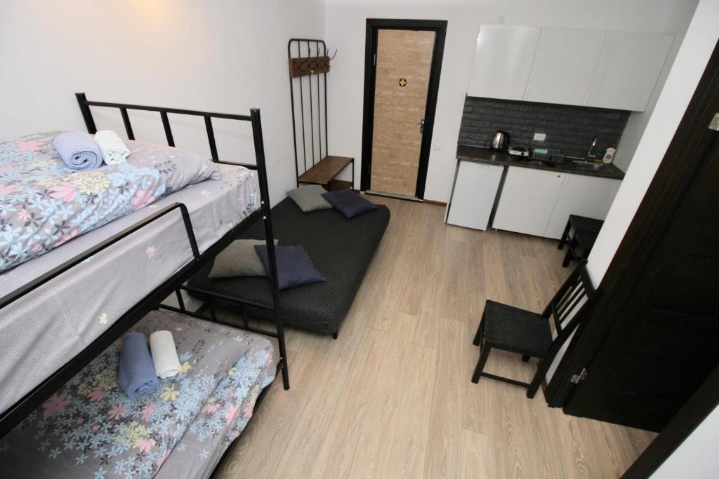 Postel nebo postele na pokoji v ubytování Apartment N322 Gudauri Loft