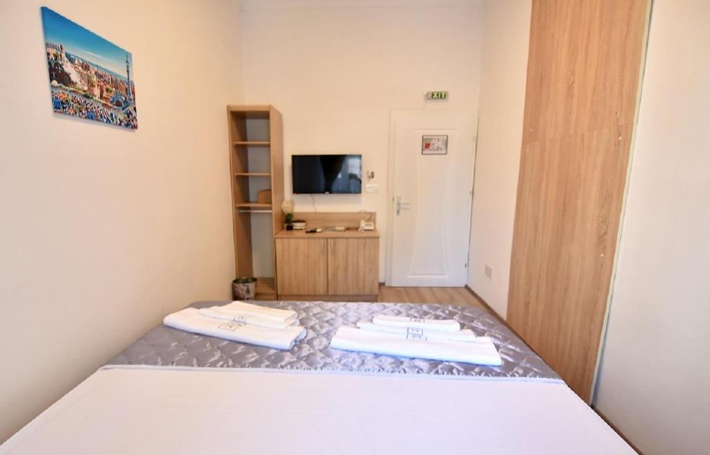 Postel nebo postele na pokoji v ubytování Villa Nina Hotel & Lounge bar
