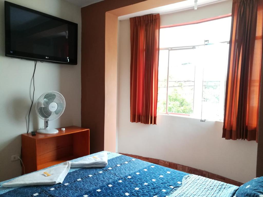 Postel nebo postele na pokoji v ubytování Hospedaje Central Piura