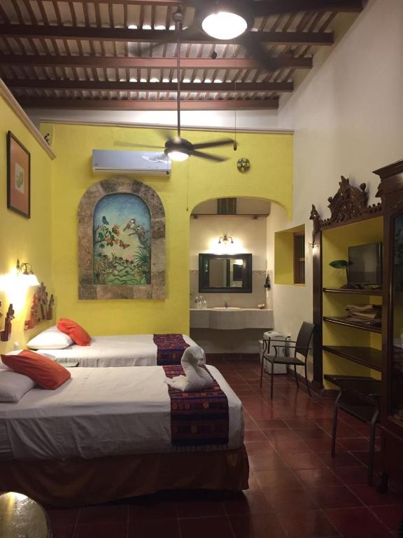 Postel nebo postele na pokoji v ubytování Hotel San Miguel Arcangel