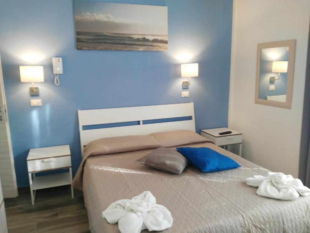 Postel nebo postele na pokoji v ubytování Hotel Marittimo