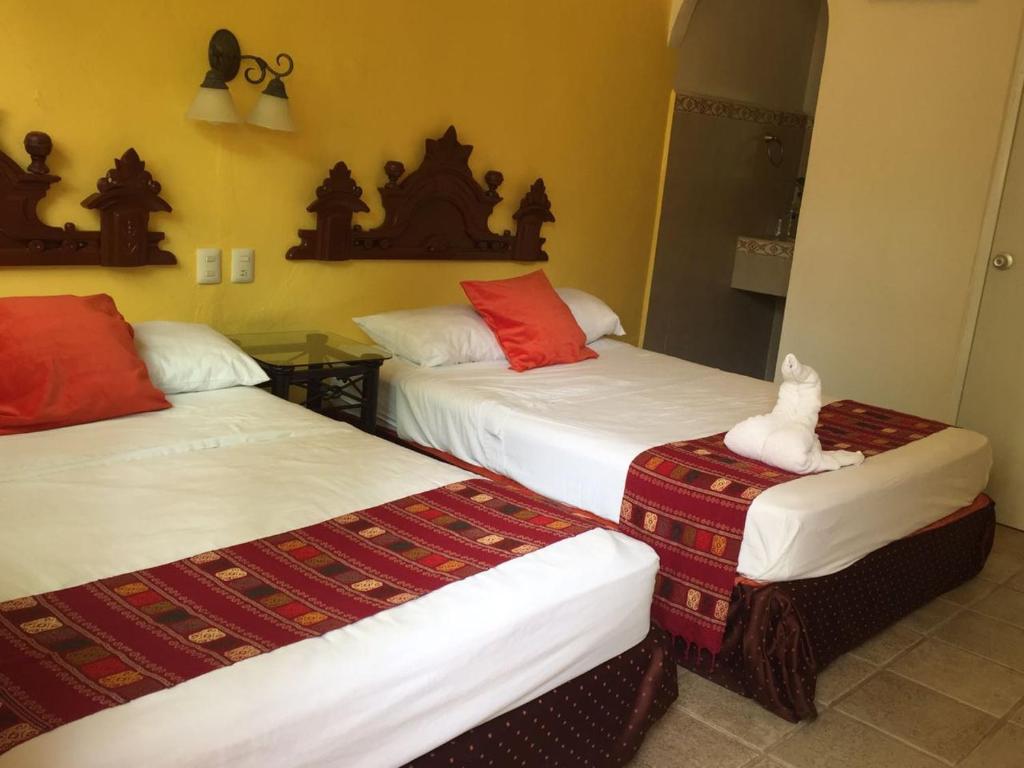 Postel nebo postele na pokoji v ubytování Hotel San Miguel Arcangel