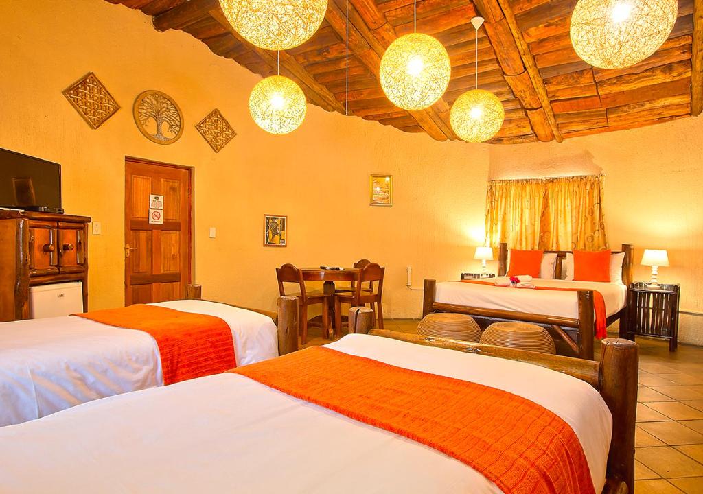 Voodi või voodid majutusasutuse Kruger Adventure Lodge toas