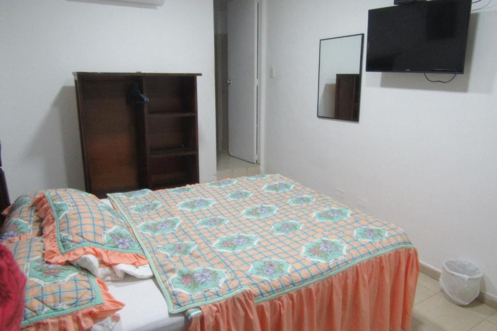 Postel nebo postele na pokoji v ubytování Hotel Nuevo Tio